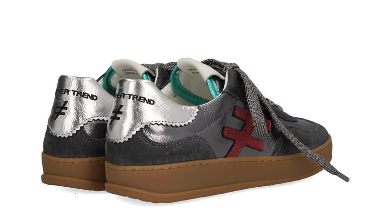 Gray sneakers with brown soles and visible branding on a white background