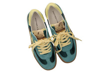 Load image into Gallery viewer, Pair of blue and green sneakers with yellow laces on a white background
