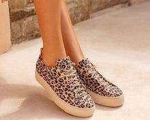 Load image into Gallery viewer, Leopard print sneakers worn indoors on a neutral background
