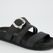 Load image into Gallery viewer, Black sandal with a silver buckle on a light gray background
