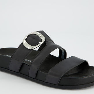 Black sandal with metallic buckle on a white background
