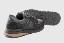 Load image into Gallery viewer, Black and gray sneaker with a visible brand logo on a light gray background
