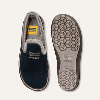 Navy slip-on shoe with gray lining on a white background