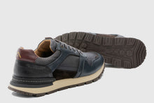 Load image into Gallery viewer, Pair of multi-colored sneakers on a light gray background
