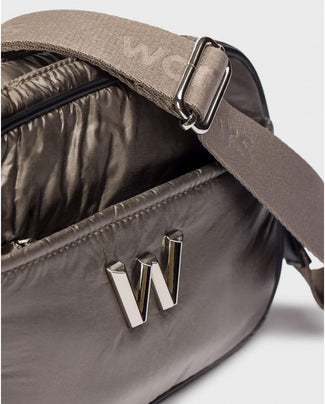 Brown crossbody bag with a logo on a light gray background