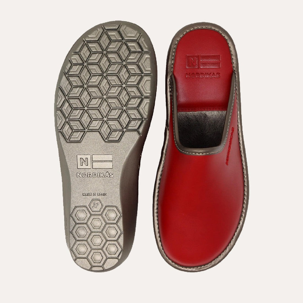 Red shoe with a visible brand logo on a white background